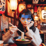 麺曜日にラーメンを食べる女性が箸を持つ